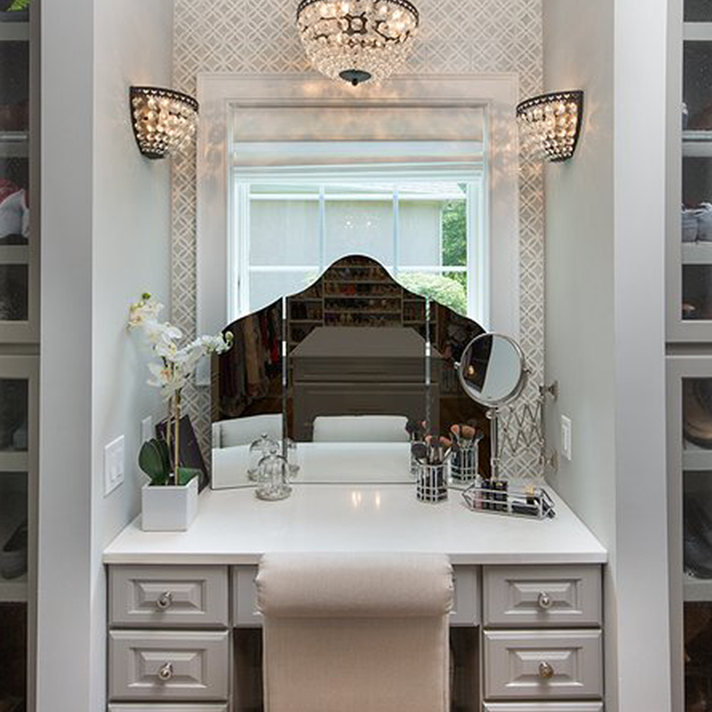 Bathroom with marble countertops, 4" backsplash and wood mirrors