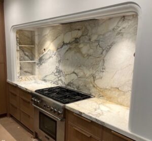 full height granite backsplash in modern luxury kitchen