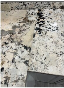 low quality granite countertop with visible defects and uneven finish