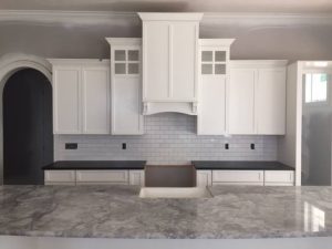 kitchen countertop seam placement near sink area in marble surface