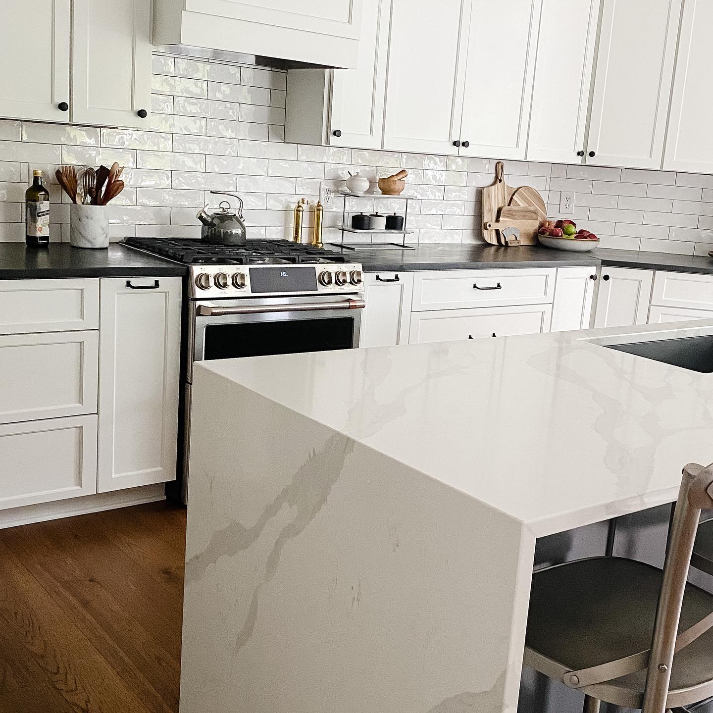 Veined quartz waterfall island countertop fabricated by Impact Countertops in Columbus, Ohio