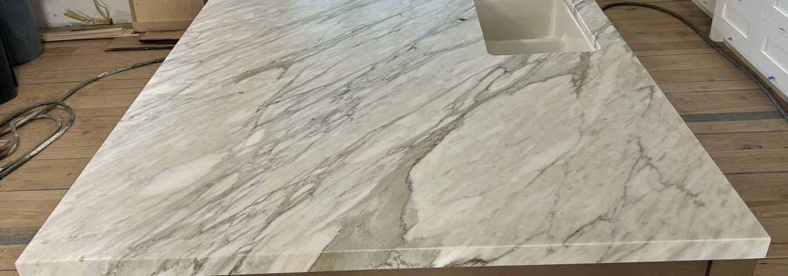 marble kitchen countertops with natural veining in modern kitchen