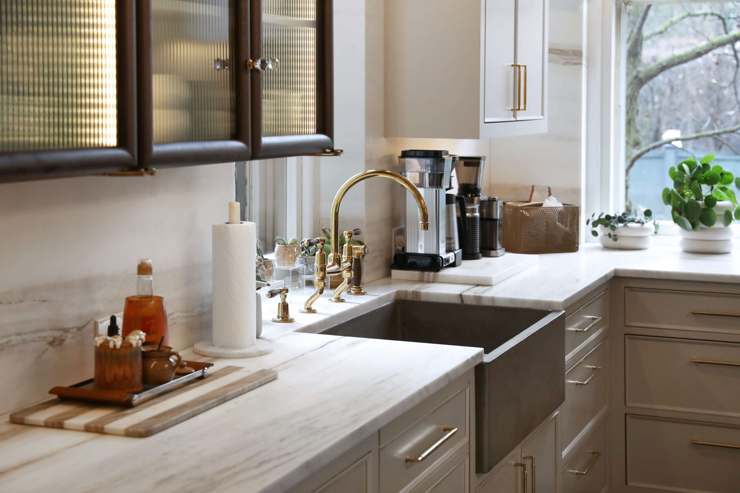 Marble kitchen with brass faucets in Columbus, Ohio