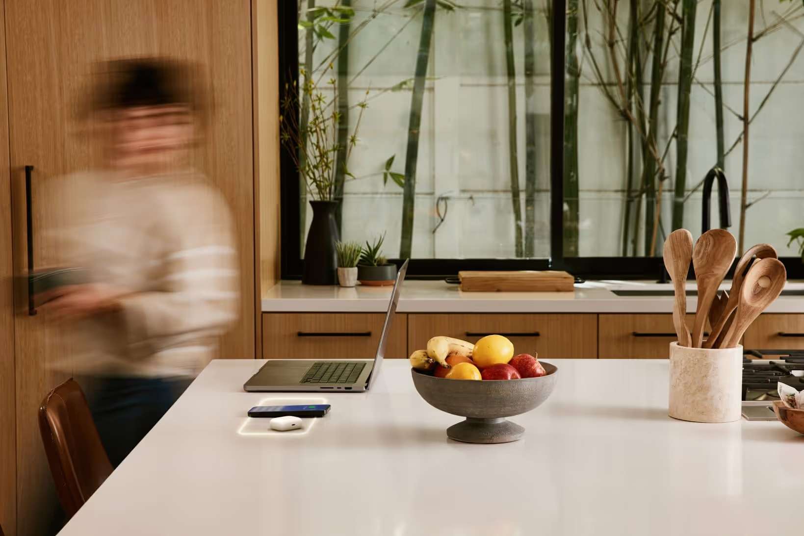 FreePower wireless charging halo glowing through a stone kitchen island countertop